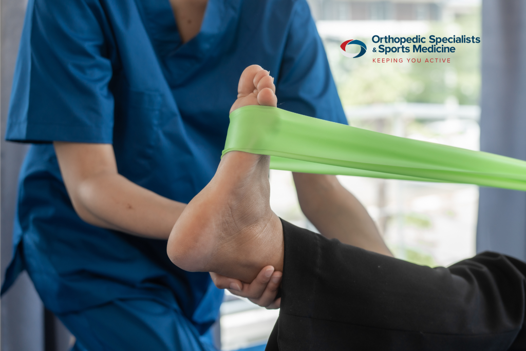 A woman getting physical therapy treatments for her ankle pain.